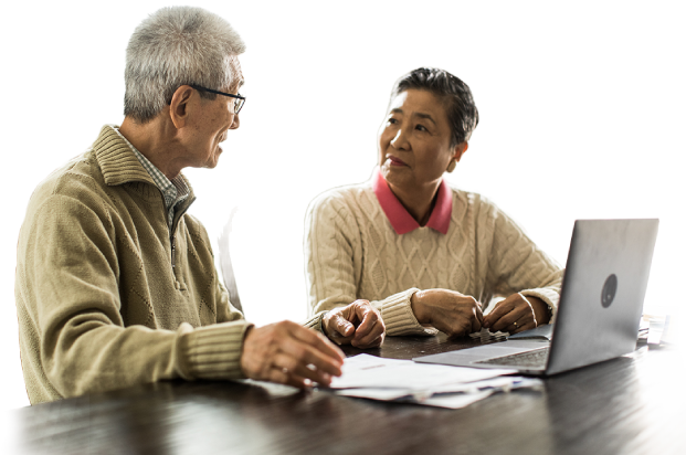 A senior couple working together on a laptop