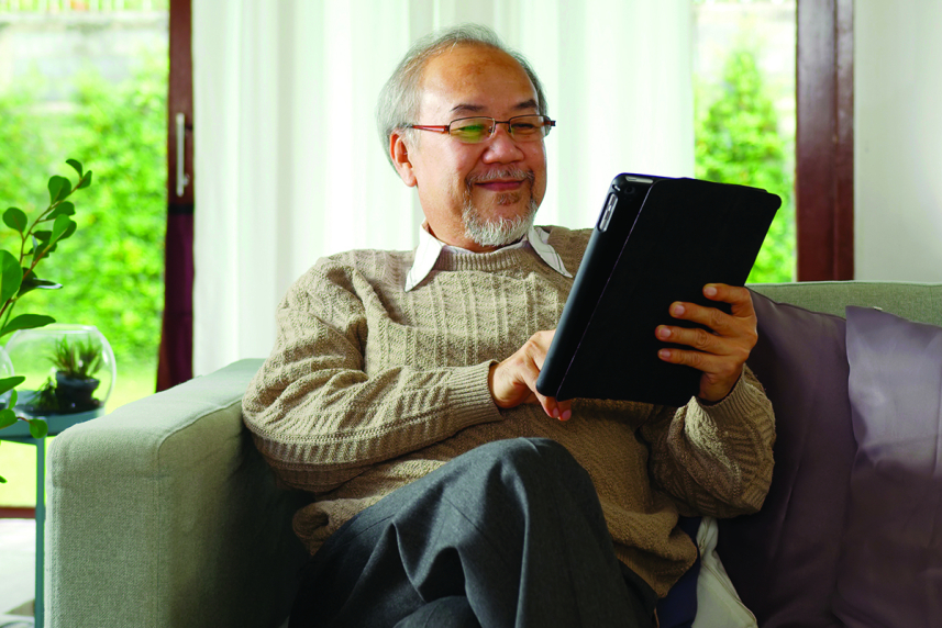 A man holding a tablet.