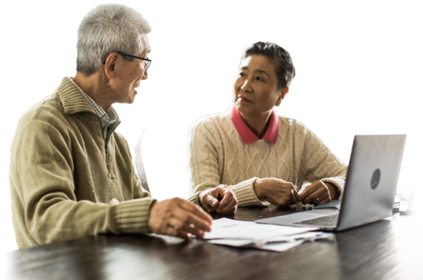A senior couple working together on a laptop