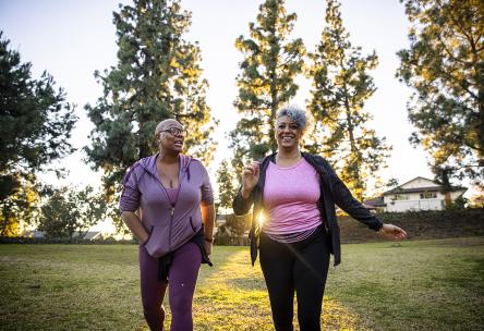 two elders walk outside