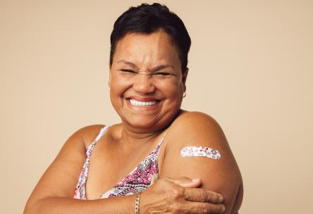 A woman with a bandage on her arm