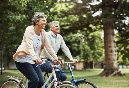 Man and woman riding bikes together