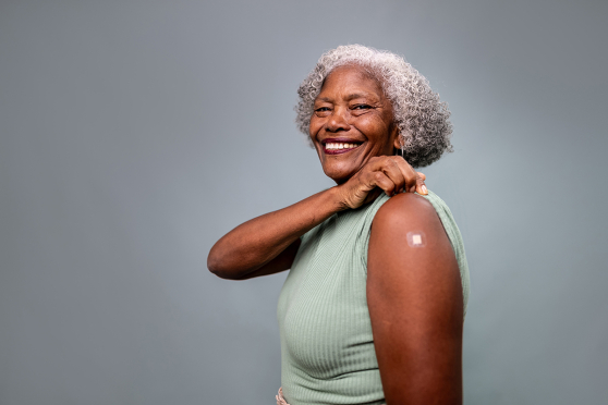 A woman with a bandage on her arm