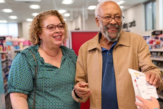 A man and a woman at a pharmacy.