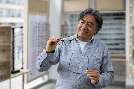 Senior picking glasses