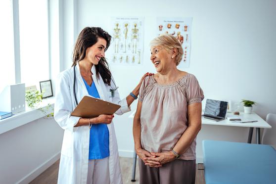 A doctor talking to a woman.