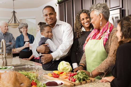 A family gathers in the kitchen